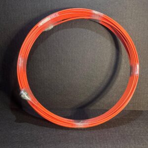 Alana 40 meter 7mm camera cable, orange, self-leveling, coiled and wrapped in plastic against a dark background.