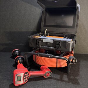 The iSpec Compact Pro WiFi pipe inspection camera system plus Ridgid Scout locator displayed on black background.