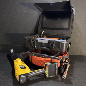 Pipe inspection camera system with orange cable reel, black monitor case, iSpec Compact Pro WiFi locator.